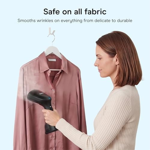 Black handheld steamer for household fabrics — photo 4
